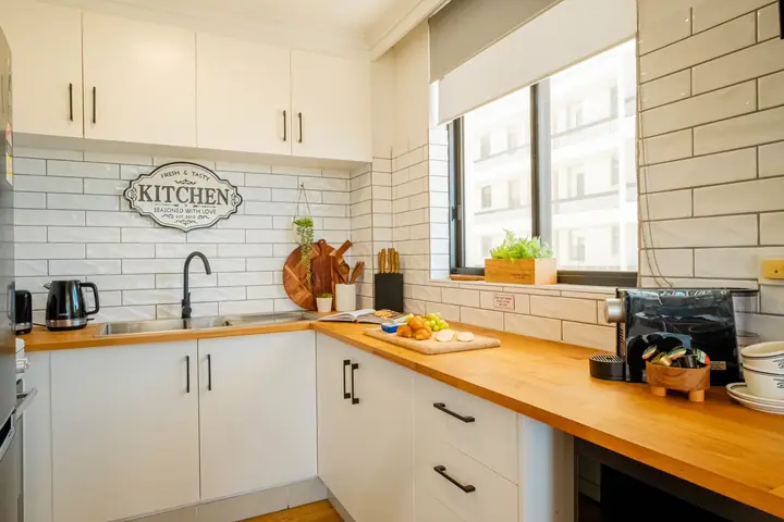 White kitchen with timber benchtops
